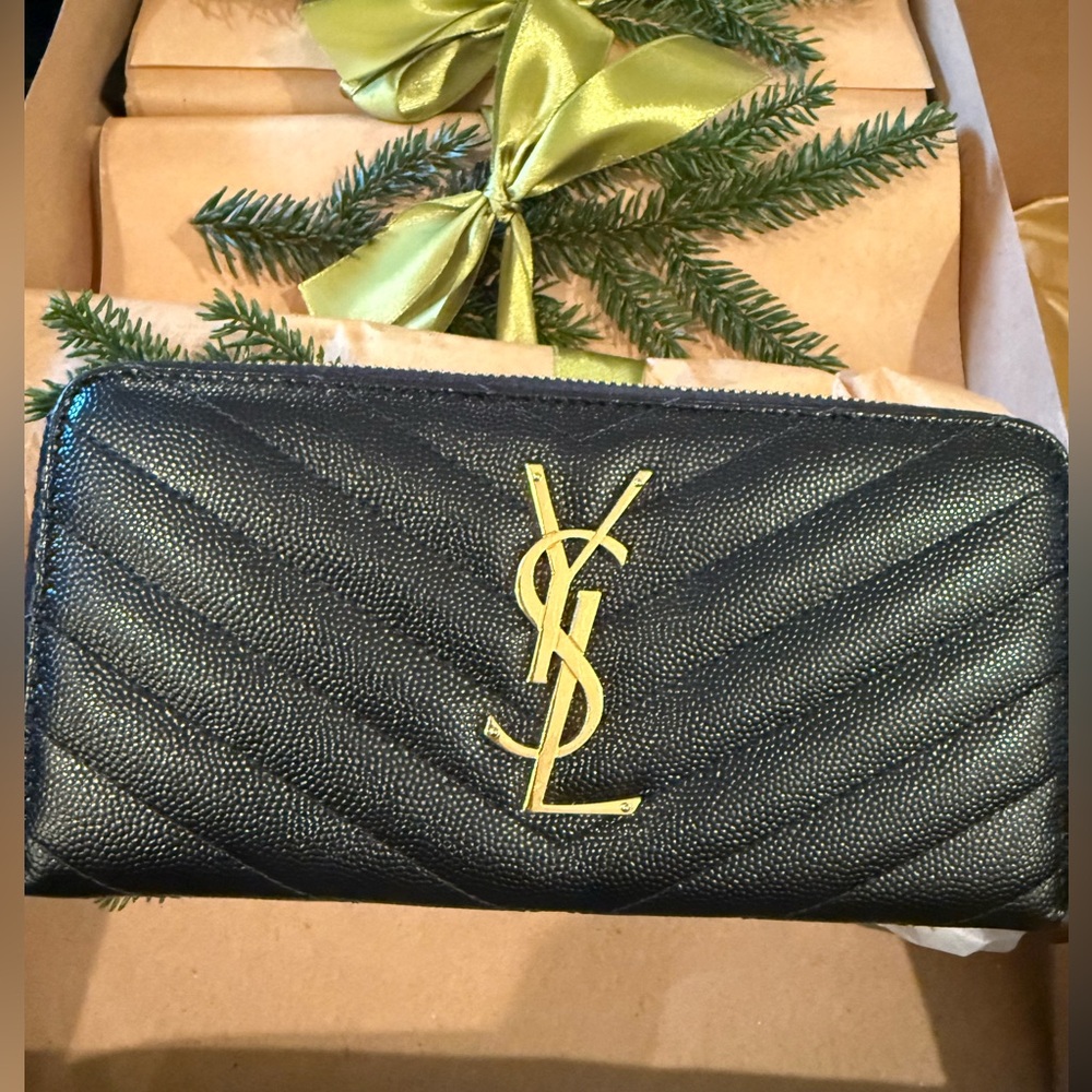 Saint Laurent YSL Authentic Monogram Large Zip Wallet in Grained Leather.